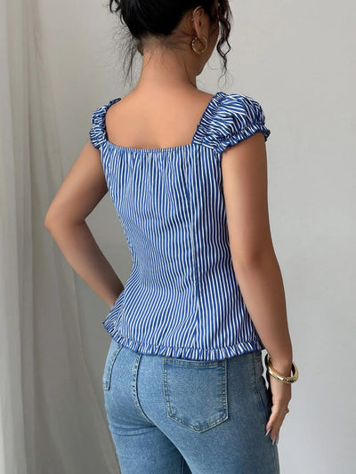 Back view highlighting the design of Striped Cap Sleeve Shirt in Dusty Blue
