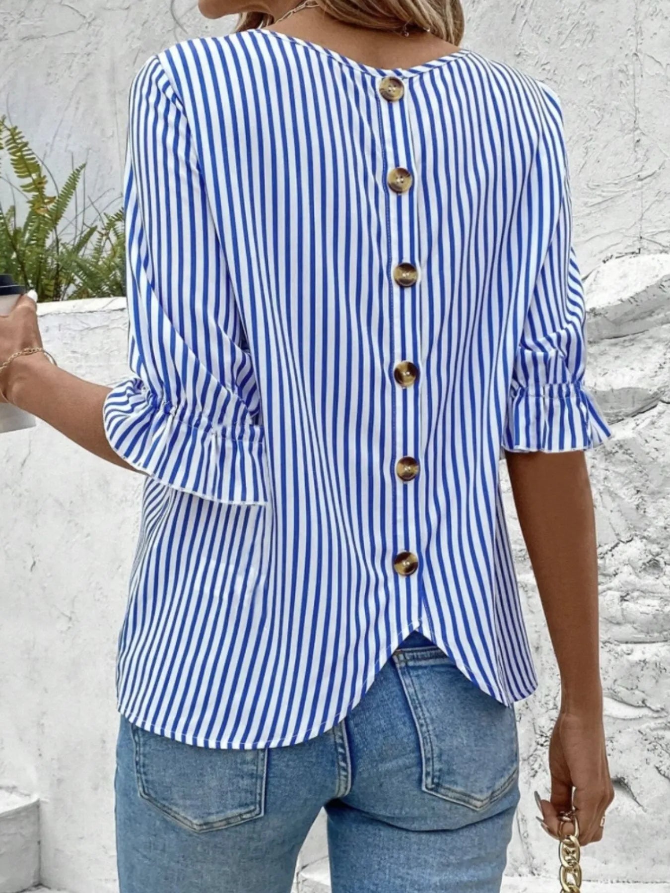 Back view highlighting the design of Striped Round Neck Half Sleeve Casual Blouse in Blue