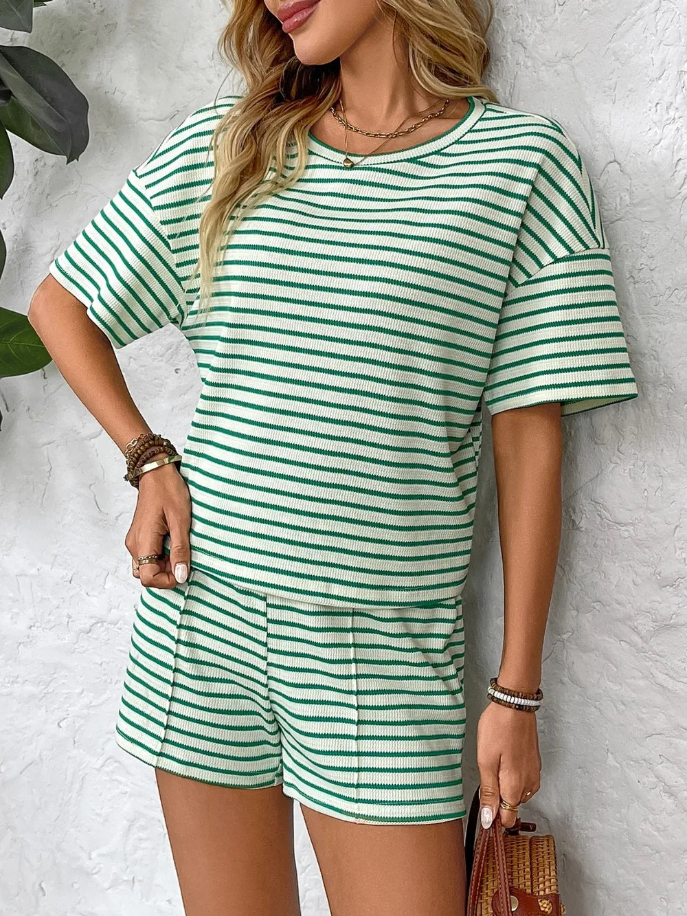 Side view showcasing the fit of Striped Round Neck Short Sleeve Top and Shorts Set in Green
