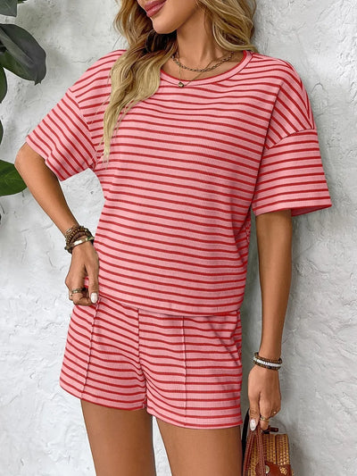 Side view showcasing the fit of Striped Round Neck Short Sleeve Top and Shorts Set in Strawberry