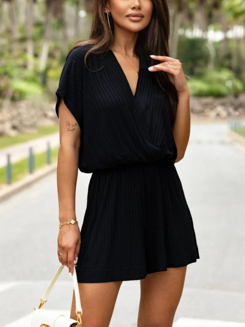 Front view of Surplice Short Sleeve Romper in Black
