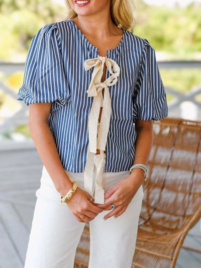 Side view showcasing the fit of Tie Front Puff Sleeve Striped Blouse in Blue Stripe