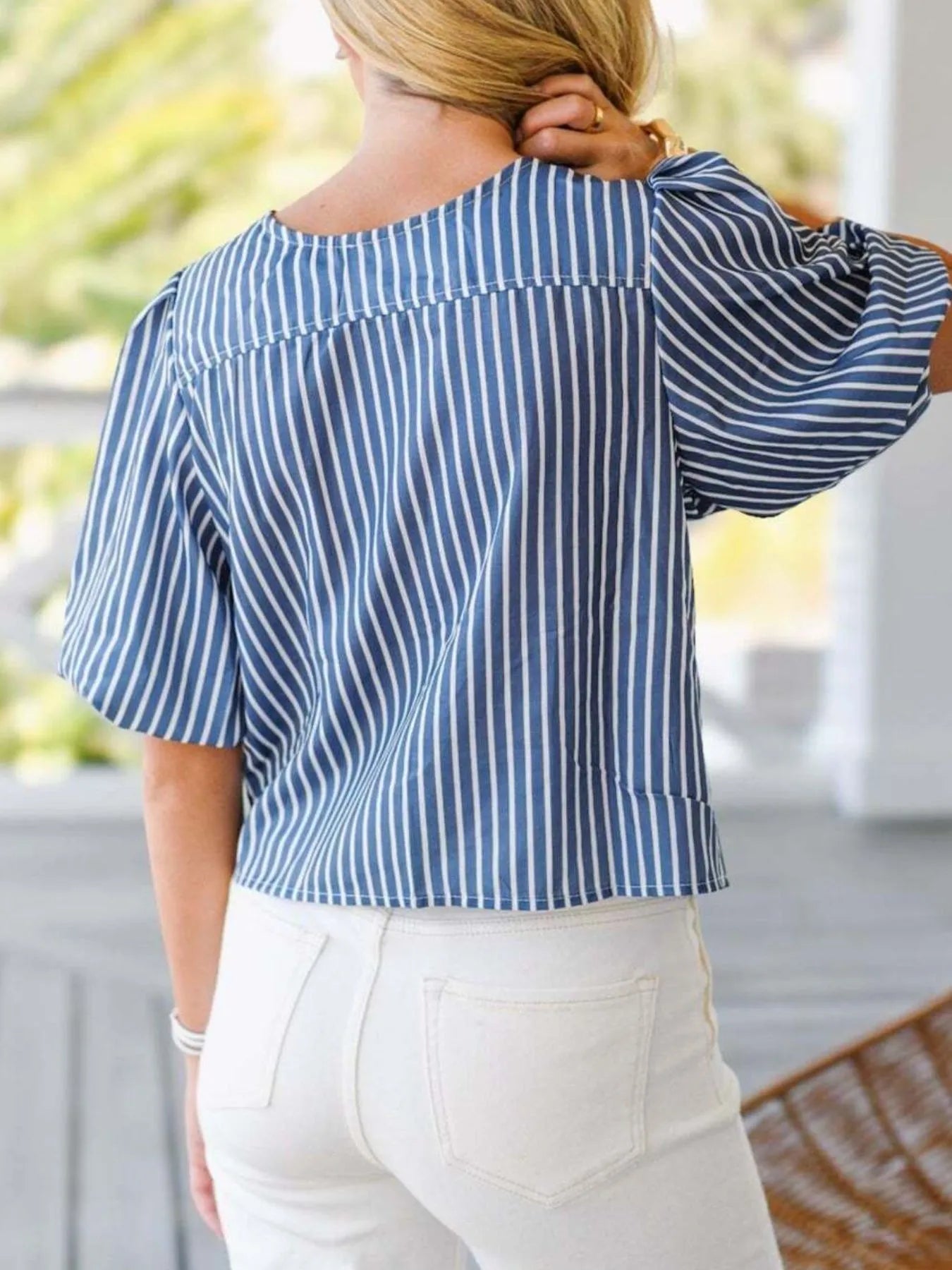 Back view highlighting the design of Tie Front Puff Sleeve Striped Blouse in Blue Stripe