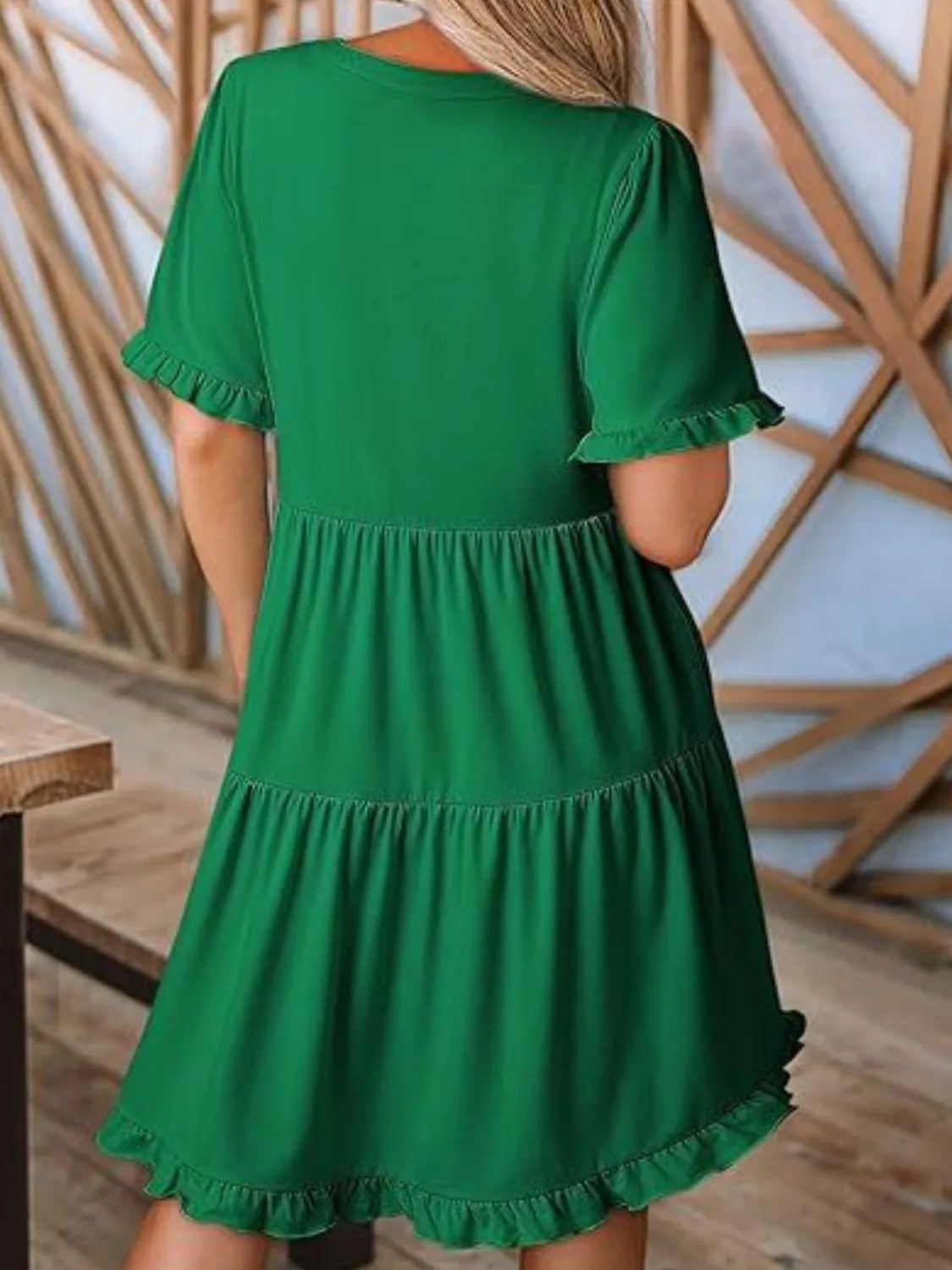 Back view highlighting the design of Tiered Notched Short Sleeve Mini Dress in Dark Green