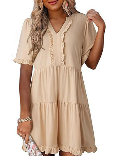 Side view showcasing the fit of Tiered Notched Short Sleeve Mini Dress in Tan
