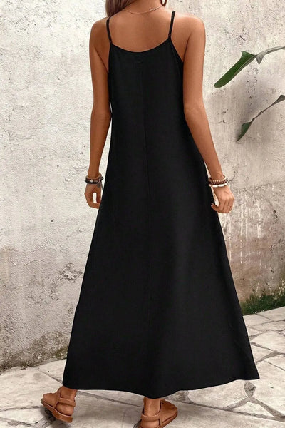 Back view highlighting the design of Tropical Leaf Print V-Neck Maxi Cami Dress in Black