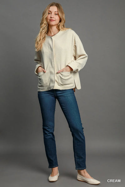 "Back view of Umgee Textured Jacquard Jacket, emphasizing the clean lines and sophisticated design.