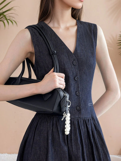 Side view of V Neck Sleeveless Midi Dress, highlighting the sleeveless cut and flowing silhouette.