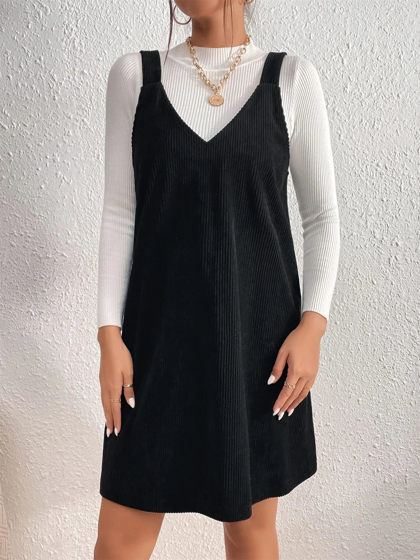 ack view of V Neck Sleeveless Mini Dress, demonstrating the clean lines and elegant fit.