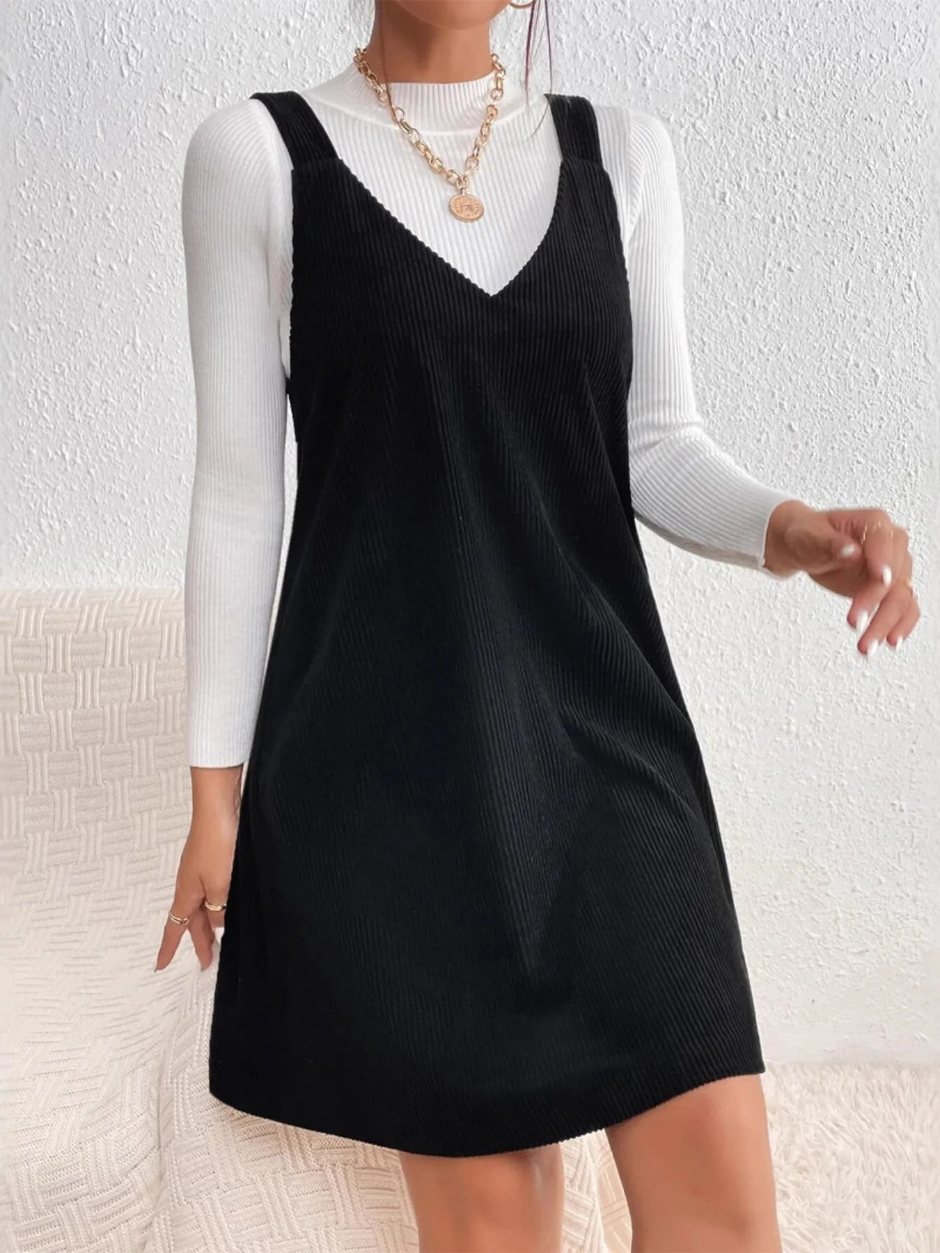 Close-up of the V-neckline on V Neck Sleeveless Mini Dress, emphasizing the stylish and flattering design.