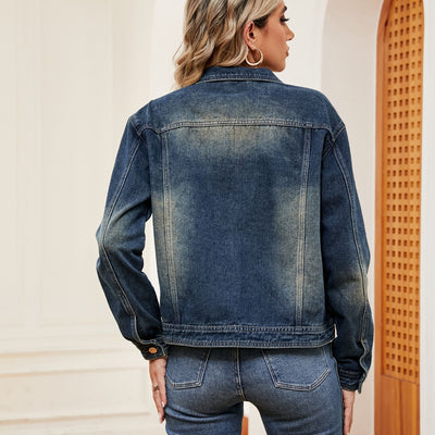 Close-up of the hem of Washed Denim Jacket, showcasing the raw-edge finish for a stylish, rugged look.
