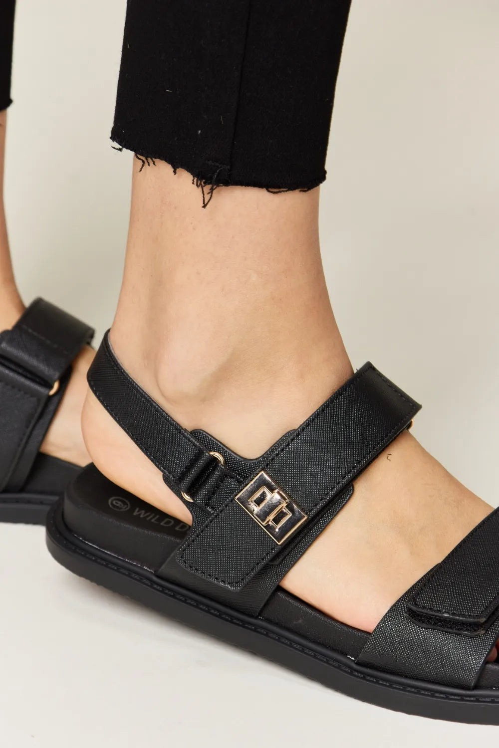 Angled view of Wild Diva Velcro Double Strap Slingback Sandals, showcasing the chic design and versatile wear.