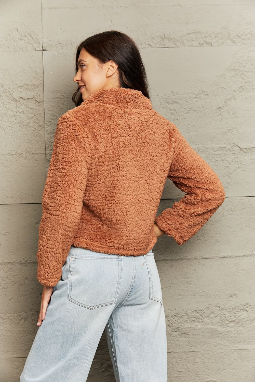 Side view of Zip-Up Collared Teddy Jacket, highlighting the relaxed fit and plush texture of the fabric.